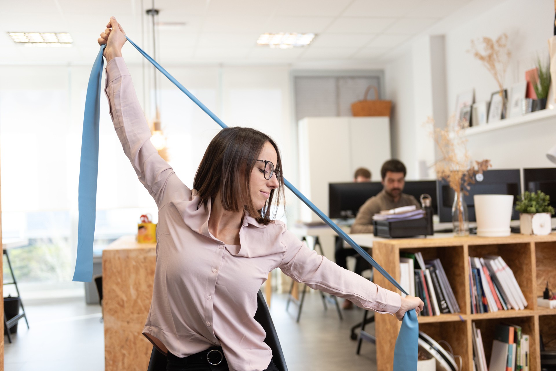 Woman stretching in the office