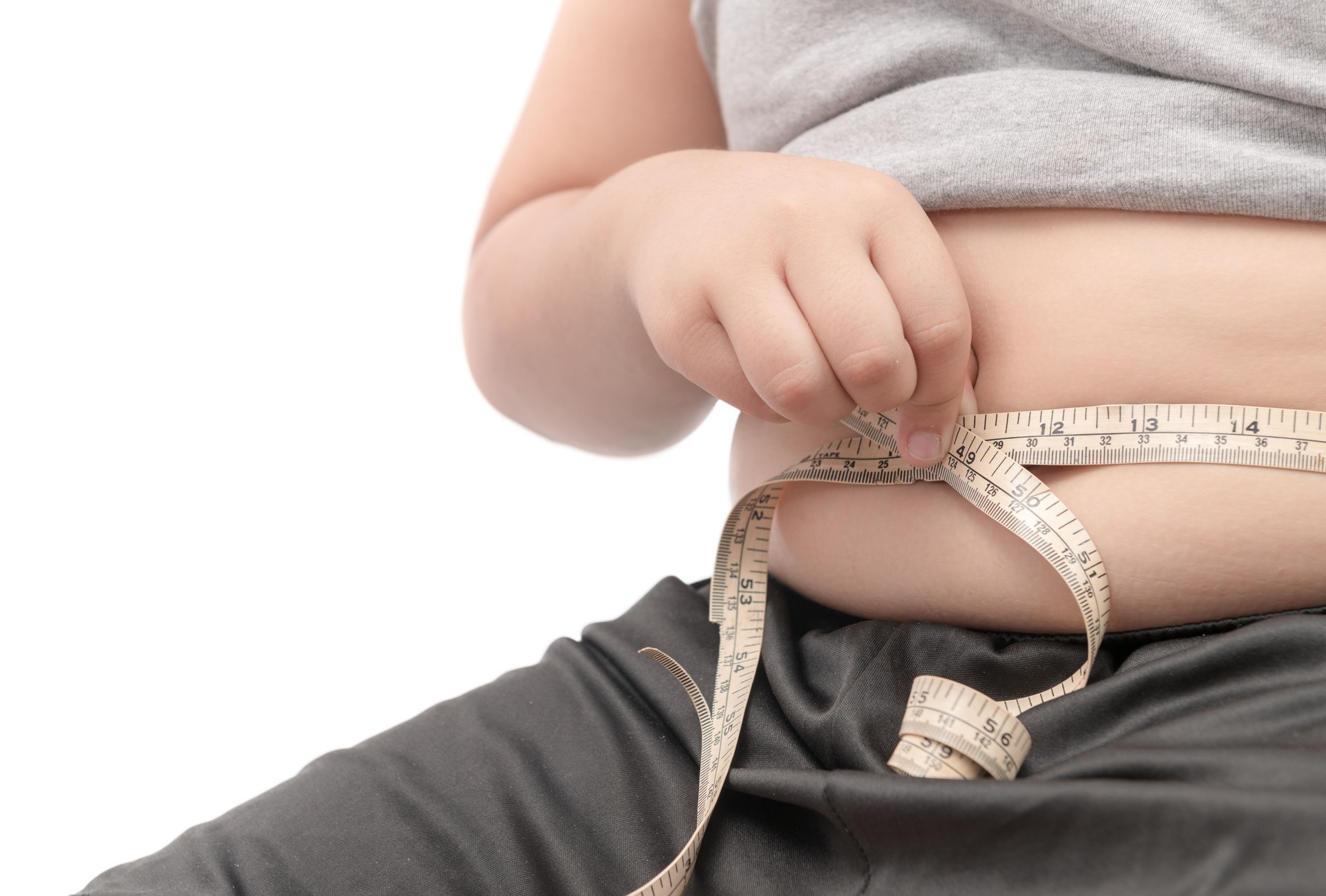 fat child check out his body fat with measuring tape